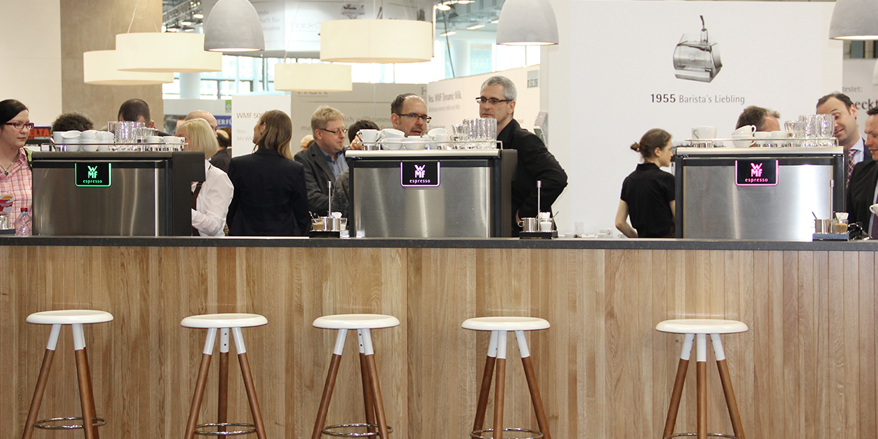 A long wooden bistro counter. People cavort chatty about the places. The scent of fresh coffee floats in the room. They drink with a nod. WMF presents its new semi-automatic portafilter machine to the public at internorga 2015! Internorga 2015 - Messe -red dot award 2015 - best of the best - design award - designship GmbH - Product design - Industrial design - Interface design - iF world design index - Top 25 Industry - Top 100 design studios worldwide - we love design
